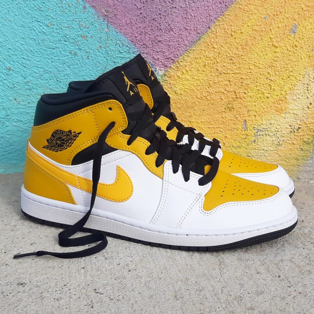 Air Jordan 1 Mid University Gold - הסניקרס שהופכות כל סטייל ללהיט! AIR JORDAN | ShoeSale